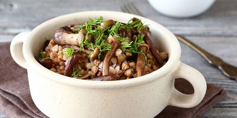 Buckwheat porridge with mushrooms for lunch on healthy nutrition menu